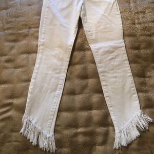 White jeans with fringe bottom